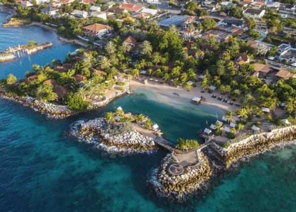 curacao resort with blue water and palm trees