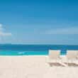 palm island grenadines chairs on beach