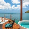 overwater bungalow with pool in view of hills