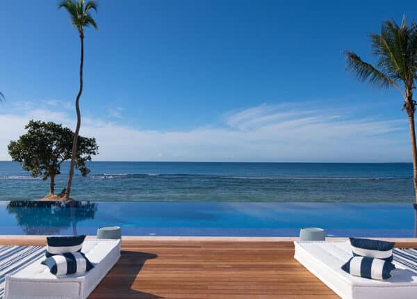 chairs on deck in front of beach