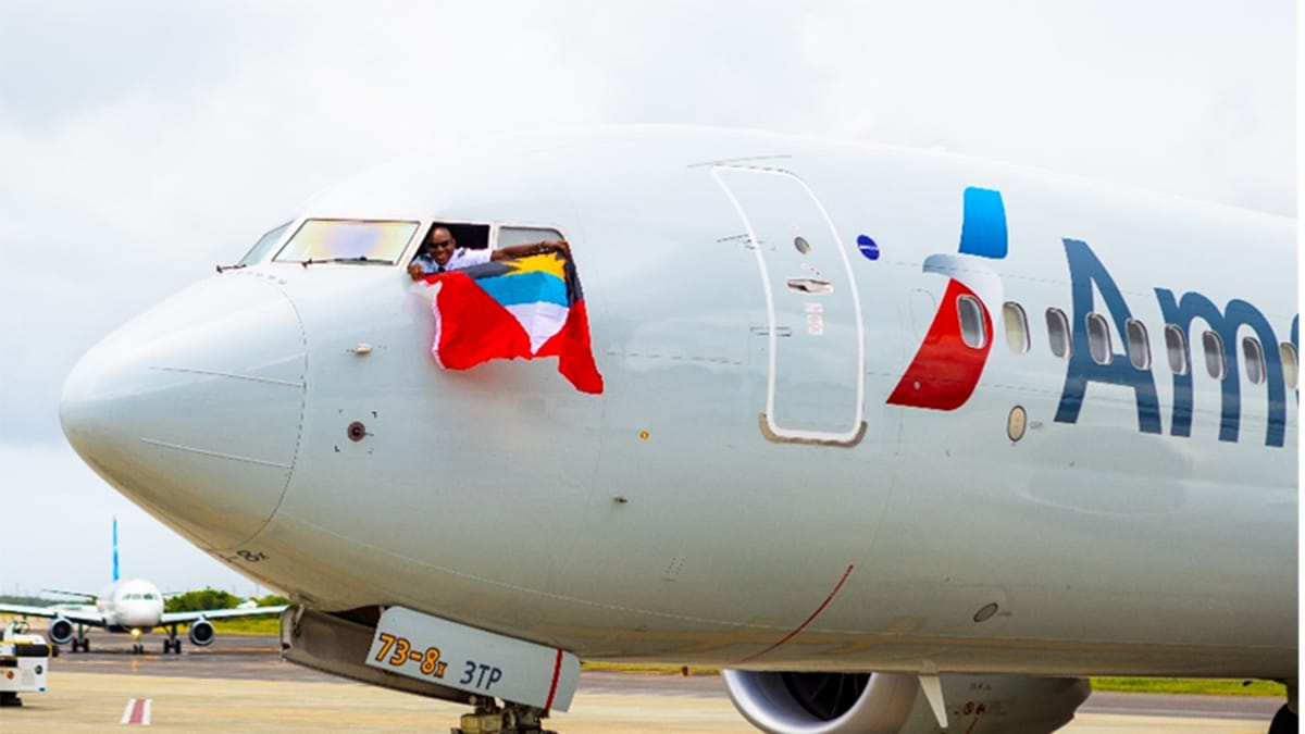 antigua barbuda american airlines flag in wondow