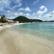 caribbean beach with green mountain