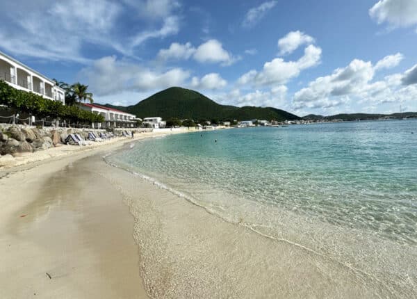 caribbean beach with green mountain