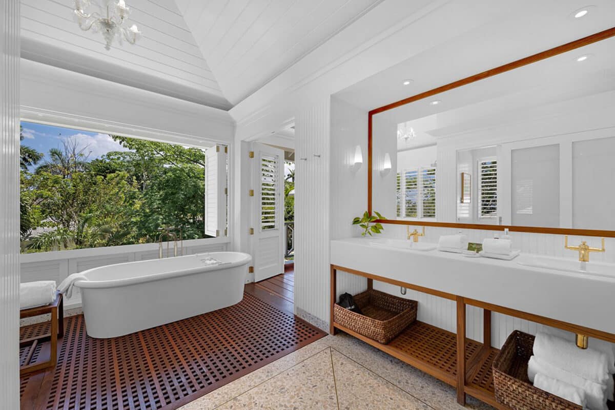 a bathroom with tub and bed