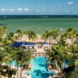 ritz-carlon san juan with pools and palm trees on the beach