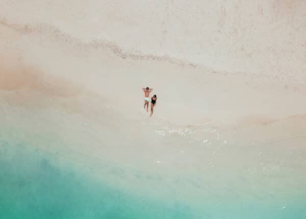 couple on the sand at ritz-carlton aruba